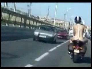 naked riding a motorcycle