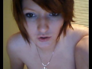 a girl with small tits hangs out naked in front of a webcam